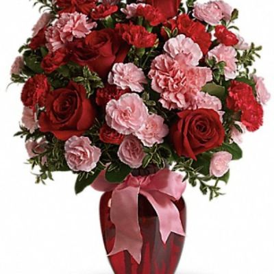 <div class="m-pdp-tabs-description">
<div id="mark-2" class="m-pdp-tabs-marketing-description">True romance will bloom brighter than ever when you surprise her with this dazzling bouquet of red roses, red carnations and other favorites in a chic ruby red vase. "Surprise" is the key word. That's when flowers mean the most.</div>
</div>
<p id="arrngDescp">This gorgeous bouquet includes red roses, red carnations, light pink carnations, red miniature carnations, light pink miniature carnations and green rhamnus accented with assorted greenery and a pink satin ribbon. Delivered in a ruby rose vase.</p>